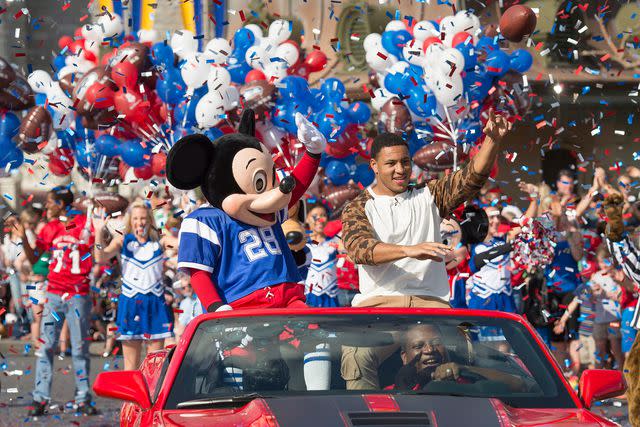 <p>Kent Phillips/Disney Parks via Getty Images</p> Malcolm Smith of the Seattle Seahawks participates in the parade following their Super Bowl XLVII win in Magic Kingdom at Walt Disney World on February 3, 2014