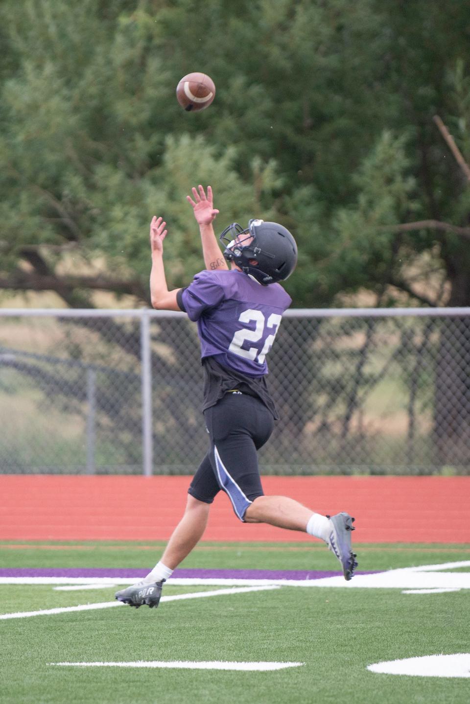 Rye's Codah Graber hauls in a pass during football practice on Thursday, August 10, 2023.