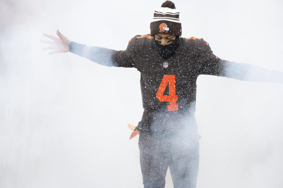 Cleveland Browns quarterback Deshaun Watson runs out during player introductions before the first half of an NFL football game against the New Orleans Saints, Saturday, Dec. 24, 2022, in Cleveland. (AP Photo/Ron Schwane)