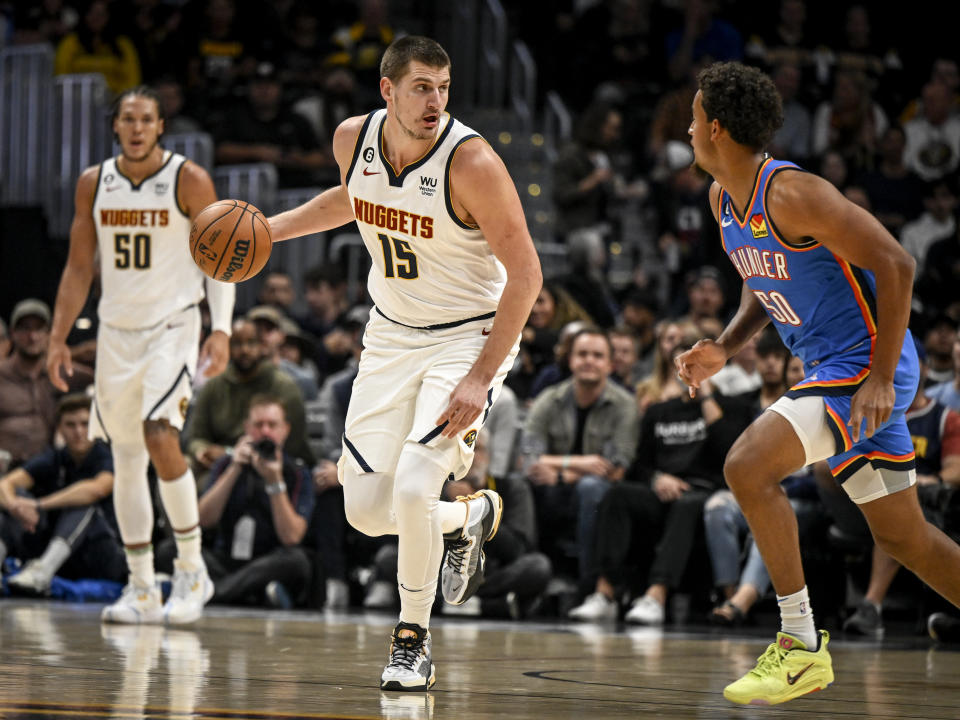 DENVER, CO - OCTOBER 3: Nikola Jokic (15) of the Denver Nuggets handles the ball in transition while Jeremiah Robinson-Earl (50) of the Oklahoma City Thunder defends in the first quarter on Monday, October 3, 2022.  (Photo by AAron Ontiveroz/MediaNews Group/The Denver Post via Getty Images)