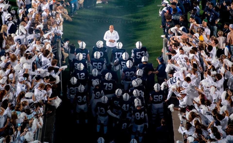 The student section cheers as Penn State football coach James Franklin faces his team before they run onto the field for the the game against Indiana at Beaver Stadium on Saturday, Oct. 2, 2021.