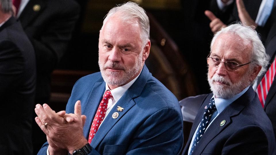 Rep. Zinke claps on the House floor