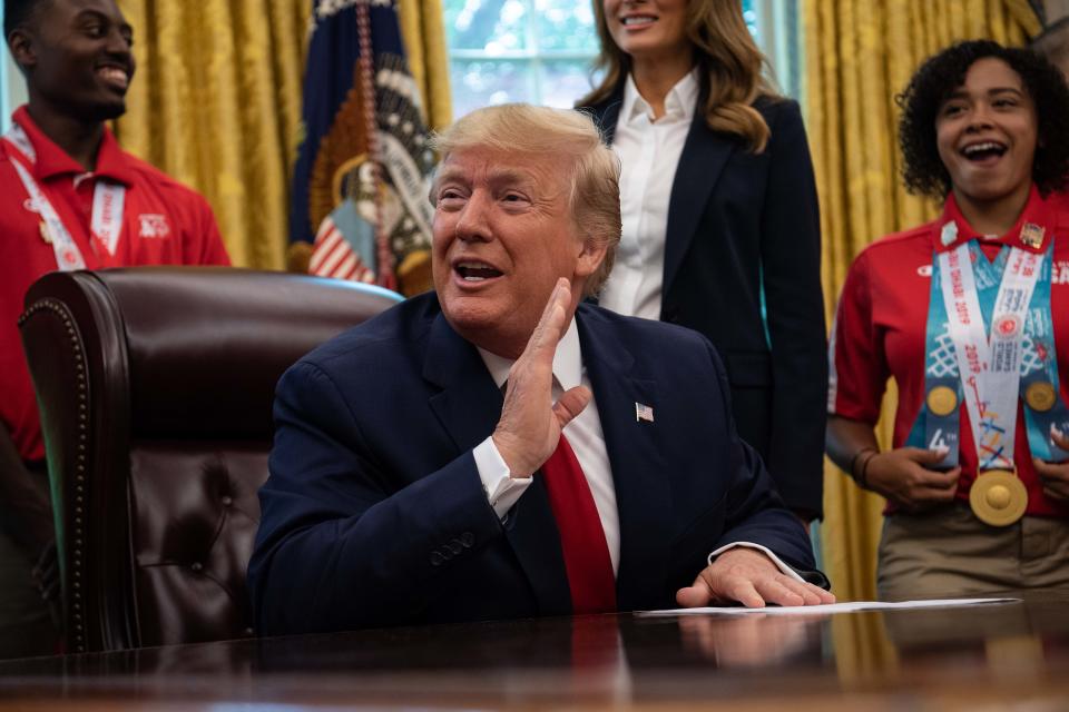 US President Donald Trump meets with members of the US Special Olympics team in the Oval Office at the White House in Washington, DC, on July18, 2019. (Photo by NICHOLAS KAMM / AFP)        (Photo credit should read NICHOLAS KAMM/AFP/Getty Images)