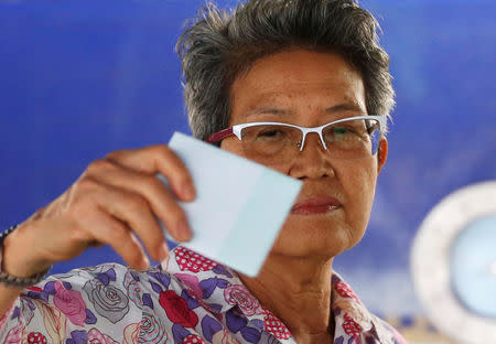 A voter casts their ballot in the general election at a polling station in Bangkok, Thailand, March 24, 2019. REUTERS/Soe Zeya Tun