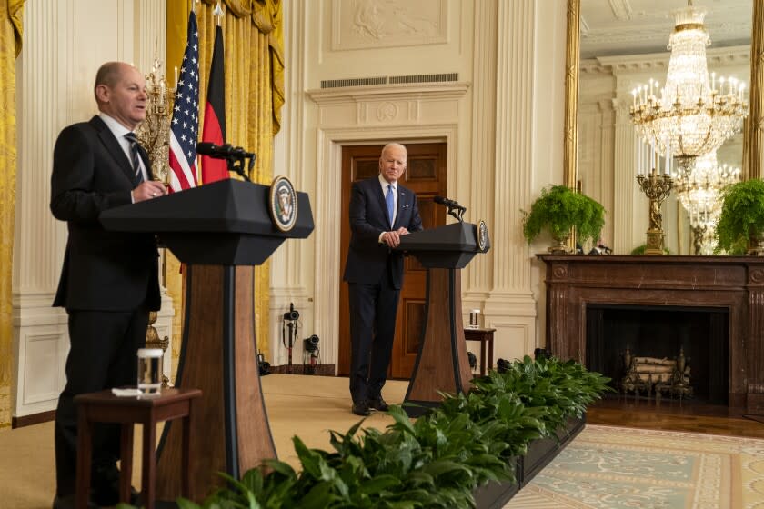 German Chancellor Olaf Scholz speaks during a joint news conference with President Biden