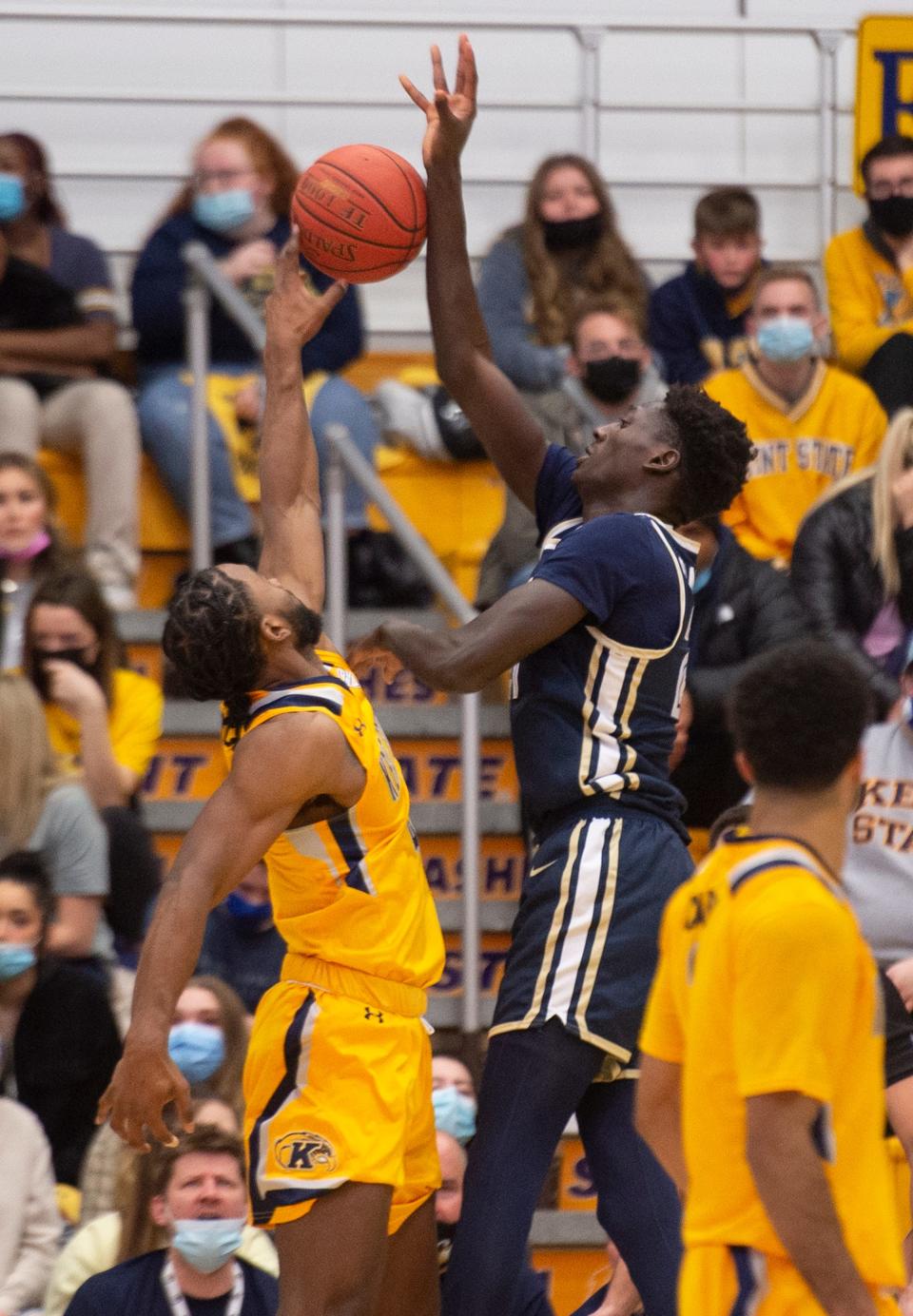 Kent State with a 67-55 victory over University of Akron. Andrew Garcia blocks a shot by Aziz Bandaogo.