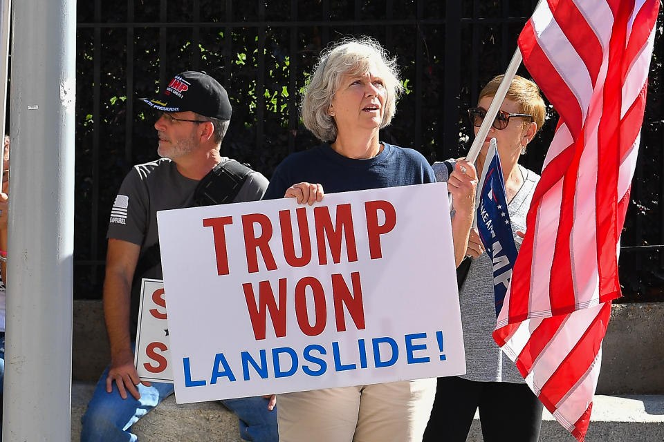 ATLANTA, GA  NOVEMBER 28:  A supporter of President Trump holds a sign at a Stop The Steal rally in front of the Georgia State Capitol Building on November 28th, 2020 in Atlanta, GA. (Photo by Rich von Biberstein/Icon Sportswire)