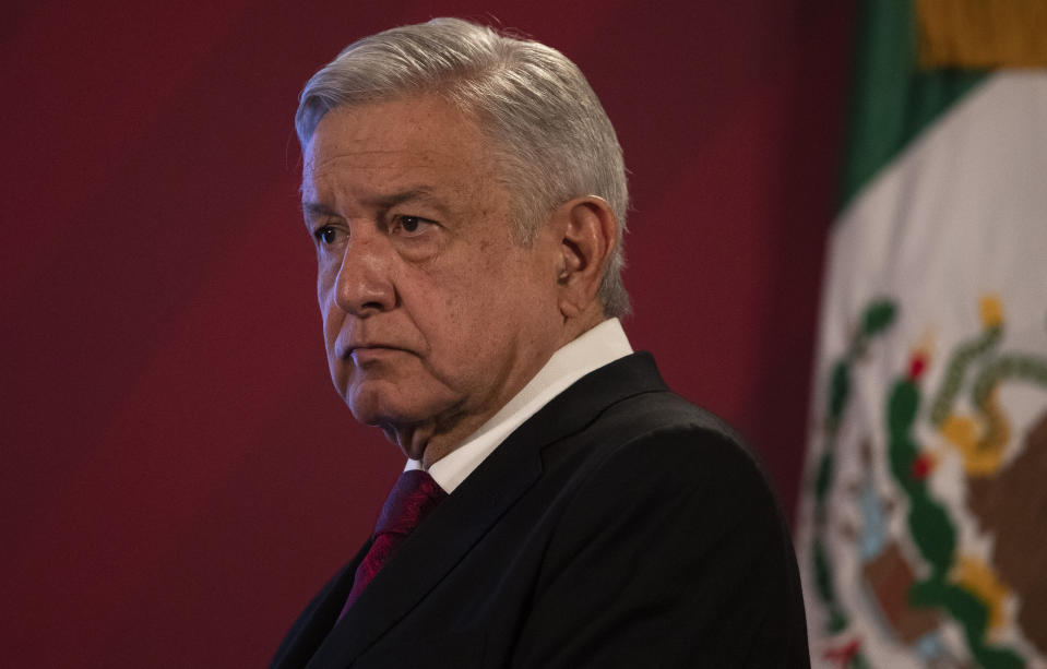 Mexico's President Andres Manuel Lopez Obrador arrives for his daily, morning news conference at the presidential palace, Palacio Nacional, in Mexico City, Monday, July 13, 2020. (AP Photo/Marco Ugarte)