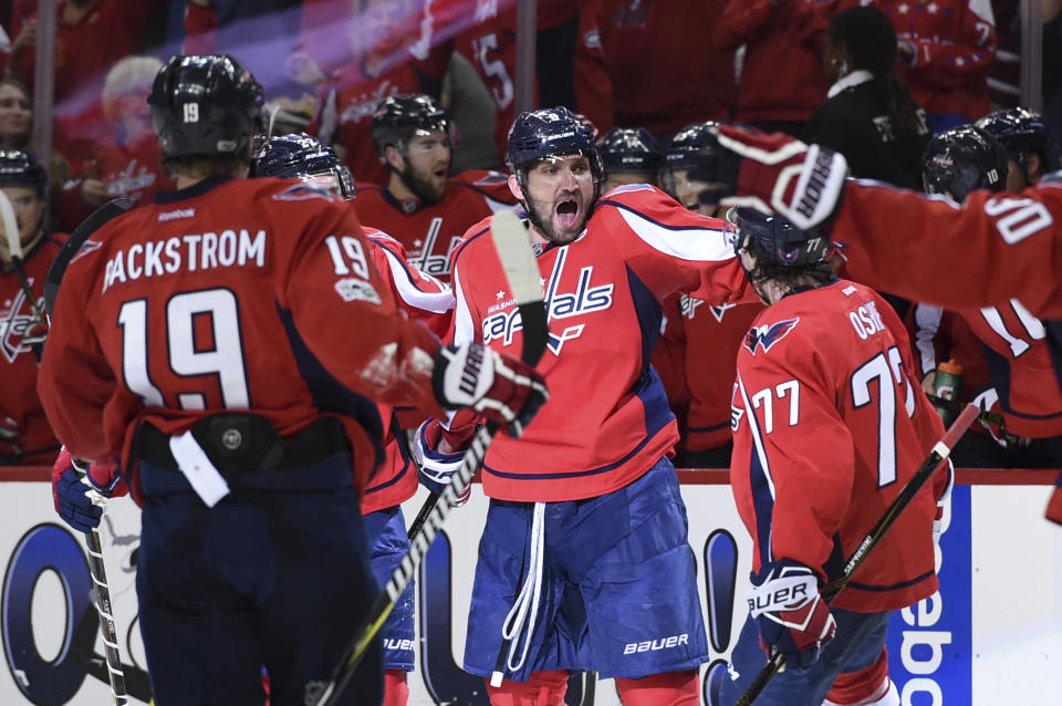 Washington Capitals left wing Alex Ovechkin (8) celebrates his goal with center Nicklas Backstrom (19) and right wing T.J. Oshie (77) against the Toronto Maple Leafs during the second period in Game 2 of an NHL Stanley Cup first-round playoff series in Washington, Saturday, April 15, 2017. (AP Photo/Molly Riley)