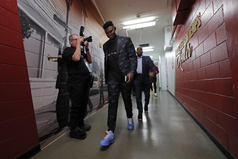 New Orleans Pelicans forward Zion Williamson arrives at the Smoothie King Center for his NBA regular season debut before an NBA basketball game against the San Antonio Spurs in New Orleans, Wednesday, Jan. 22, 2020. Williamson was injured his knee in preseason and has been cleared to play for his first regular season game. (AP Photo/Gerald Herbert)