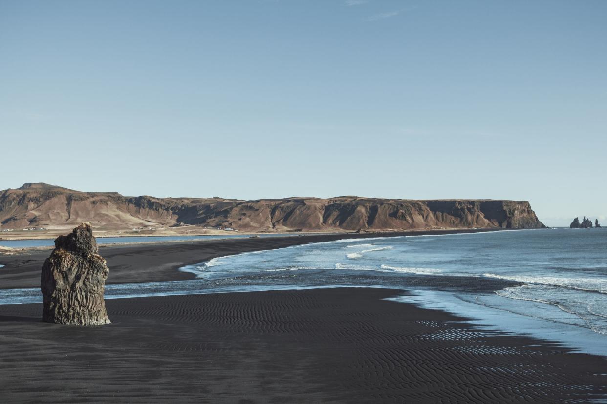 black sand beach and reynisdrangar stack rocks of vik i myrdal, iceland. northern europe.