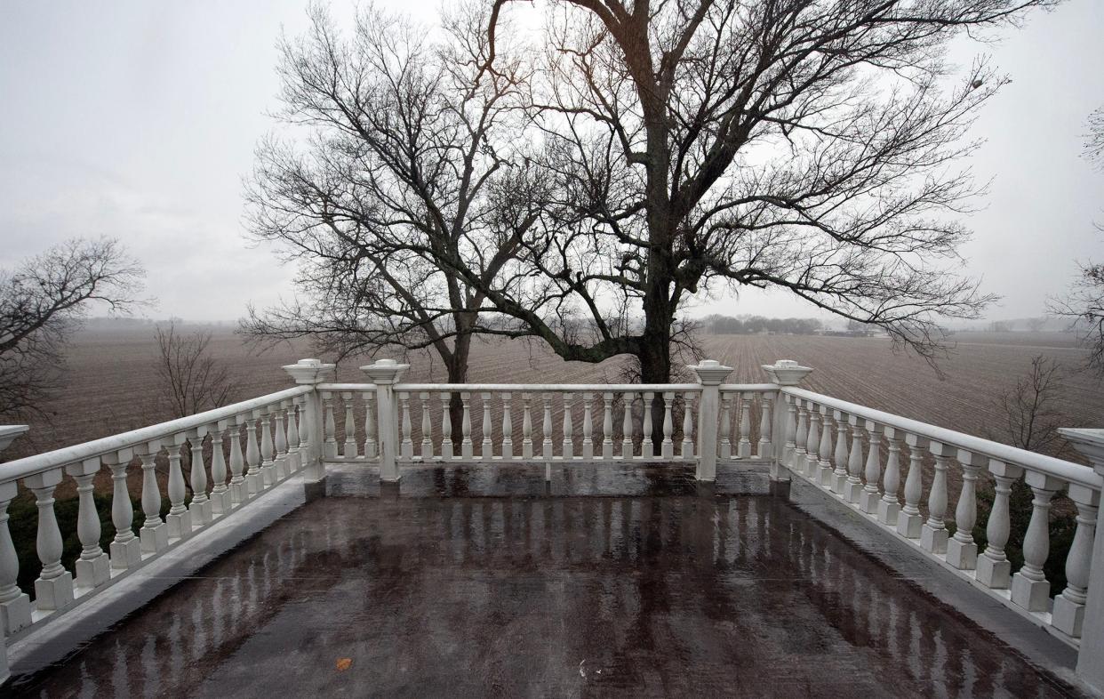 Rain blankets the second-floor balcony on the west side of Mont Helena in Rolling Fork, Miss., Monday, Jan. 8, 2024.