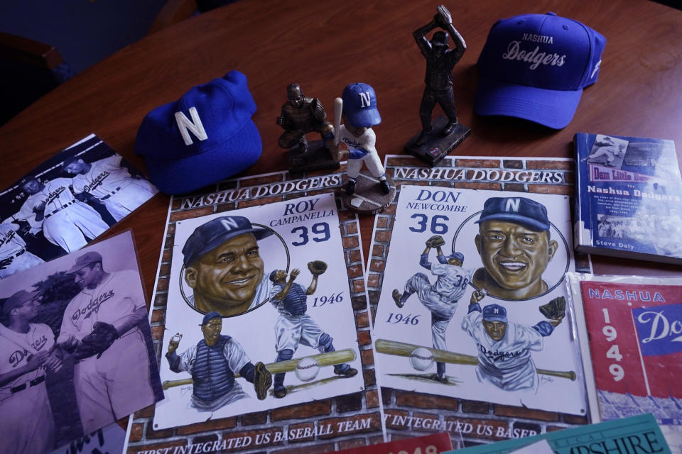 A selection of Nashua Dodgers memorabilia is displayed at City Hall, Tuesday, May 23, 2023, in Nashua, N.H. Holman Stadium in Nashua is being recognized for hosting the country's first racially integrated baseball team, the Nashua Dodgers, in 1946. The club was a minor league league affiliate of the Brooklyn Dodgers, which included Hall of Famer Roy Campanella and future Cy Young Award winner Don Newcombe. (AP Photo/Charles Krupa)