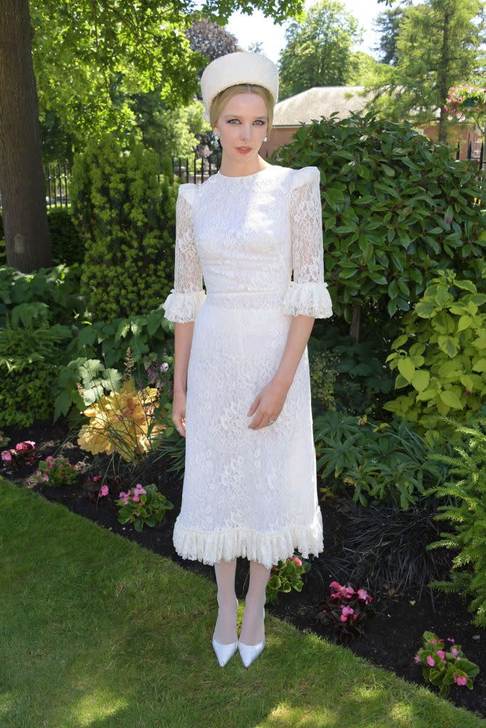 <p>Greta Bellamacina dressed up in a lace white dress by The Vampire's Wife. </p>