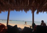 Tourists enjoy their summer vacation on a beach at a Red Sea resort, amid the coronavirus disease (COVID-19) outbreak, in Hurghada