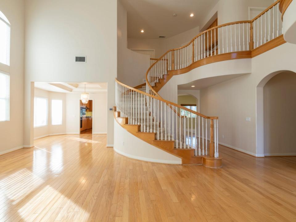 An empty entryway and dining area.