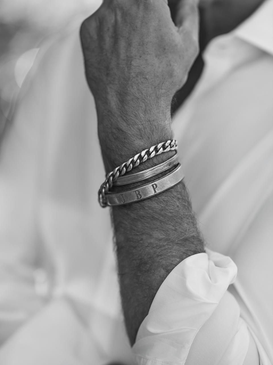 Pearson wears three silver bracelets, one for each of his three children