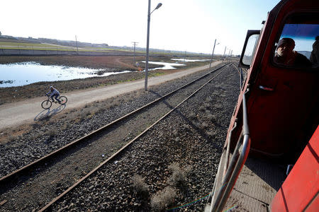 People ride a train in Aleppo, Syria February 1, 2017. REUTERS/Omar Sanadiki