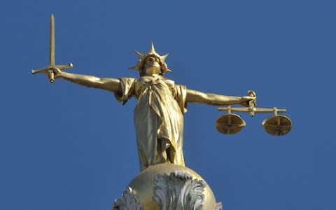 The Lady Justice statue atop the Central Criminal Court - Credit: Nick Ansell/PA