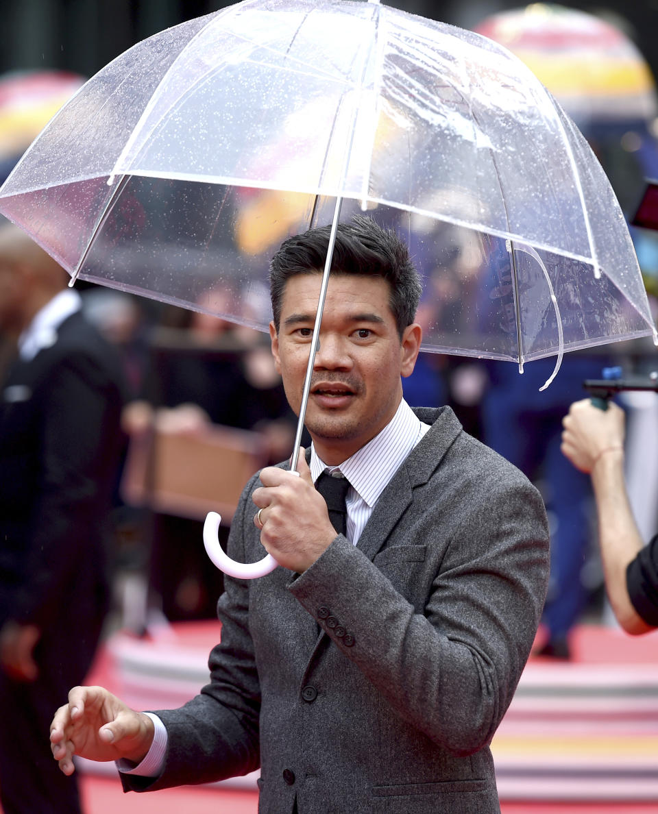 Director Destin Daniel Cretton carries an umbrella as he attends the premiere for "Just Mercy" on day two of the Toronto International Film Festival at the Roy Thomson Hall on Friday, Sept. 6, 2019, in Toronto. (Photo by Chris Pizzello/Invision/AP)
