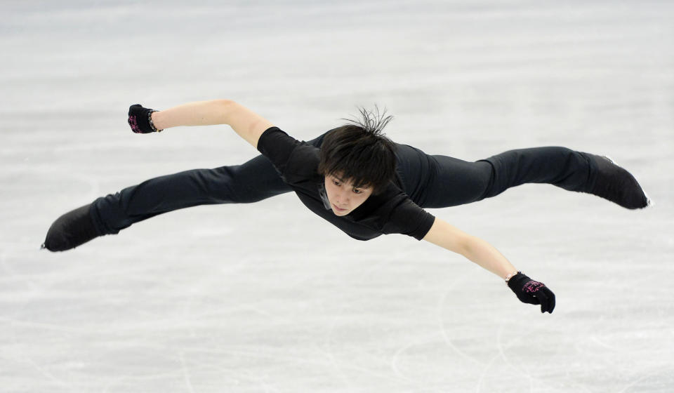 In this Monday, March 24, 2014 photo, Japanese teenager Yuzuru Hanyu practices ahead of the World Figure Skating Championships in Saitama, near Tokyo. Hanyu is aiming to add a world title to his Olympic gold medal when the world championships begin Wednesday.(AP Photo/Kyodo News) JAPAN OUT, MANDATORY CREDIT