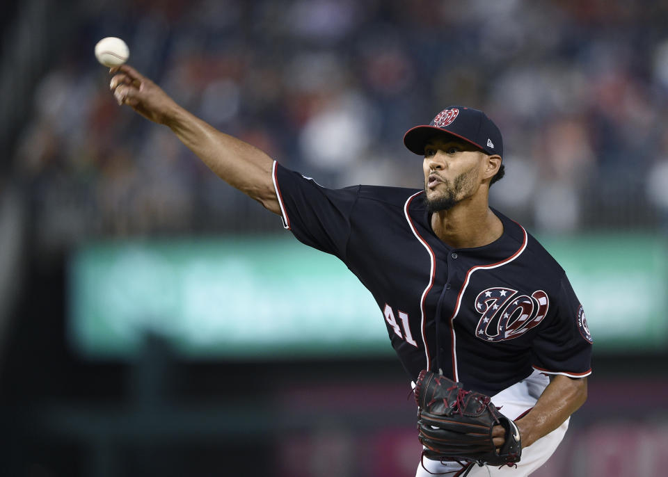 Washington Nationals starting pitcher Joe Ross delivers a pitch during the first inning of the team's baseball game against the New York Mets, Friday, Sept. 21, 2018, in Washington. (AP Photo/Nick Wass)