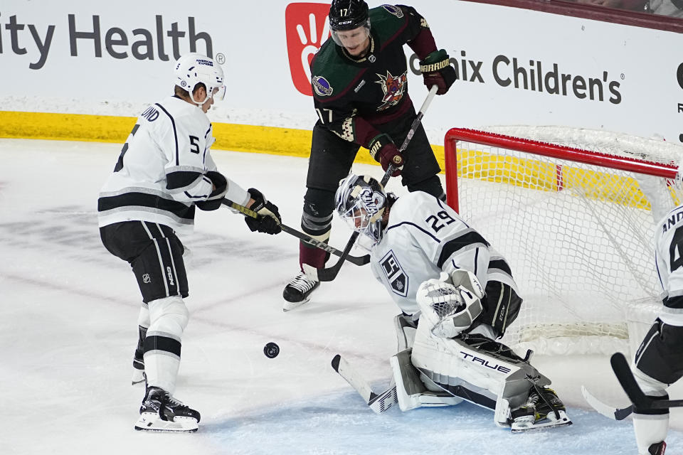 Los Angeles Kings goaltender Pheonix Copley (29) stops a shot on goal by Arizona Coyotes center Nick Bjugstad (17) during the third period of an NHL hockey game, Monday, Nov. 20, 2023, in Tempe, Ariz. (AP Photo/Matt York)