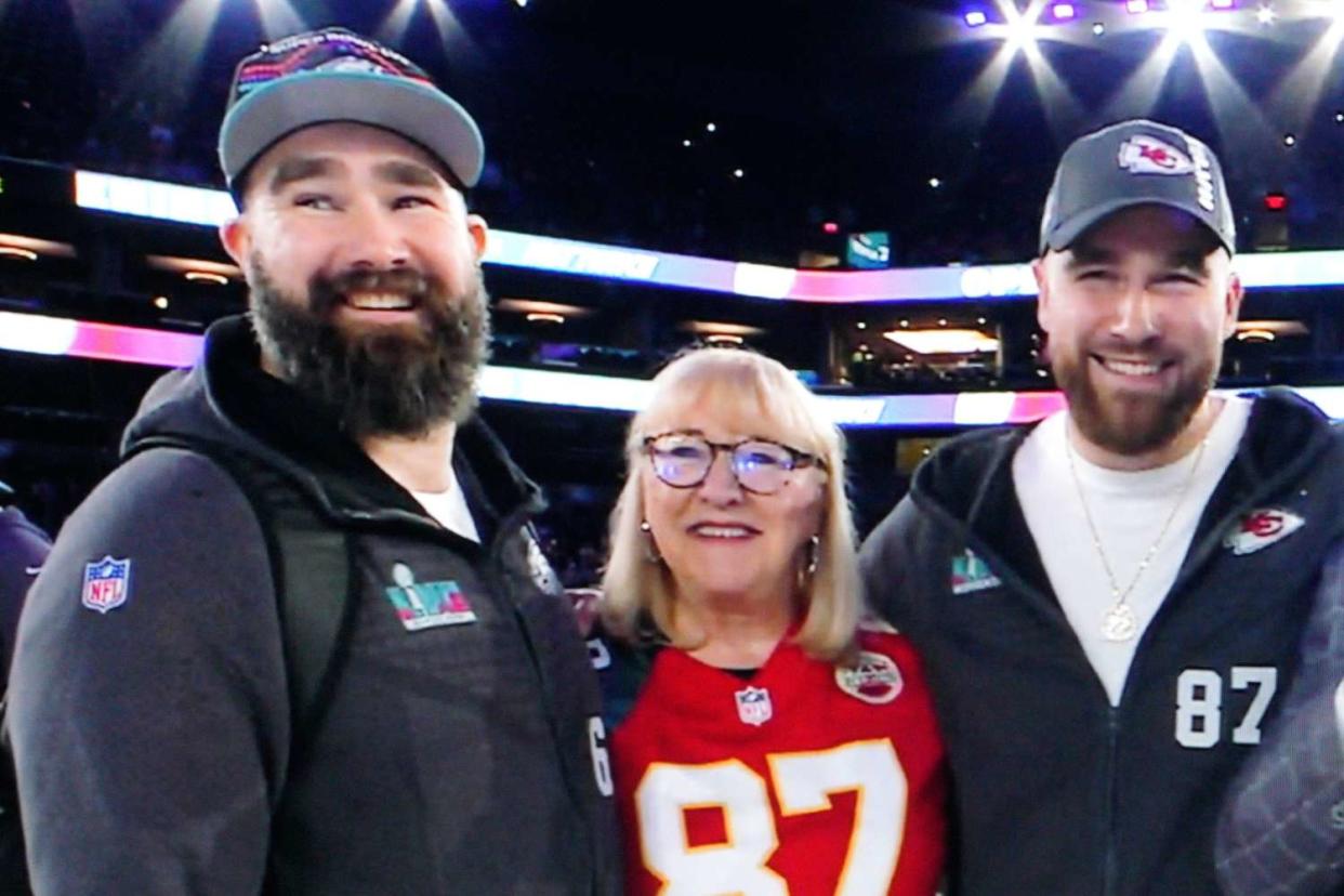 <p>Dave Shopland/Shutterstock</p> Donna Kelce with sons Jason (left) and Travis (right) in Feb. 2023
