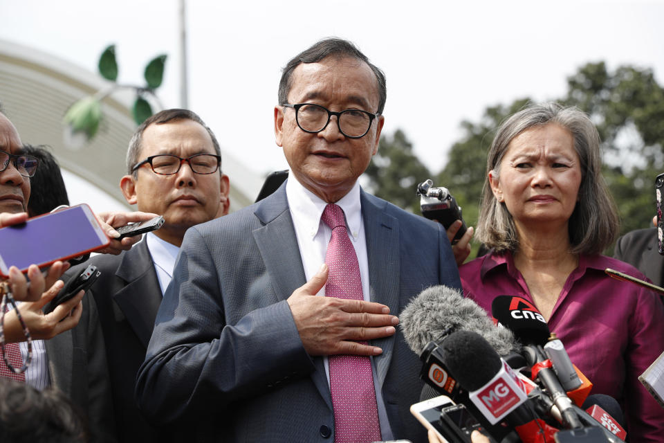 Cambodia's exiled opposition leader Sam Rainsy talks to the media outside Parliament House in Kuala Lumpur, Malaysia, Tuesday, Nov. 12, 2019. Rainsy landed in Kuala Lumpur in a bid to return to his homeland after Thailand had earlier blocked him from entering. (AP Photo/Vincent Thian)