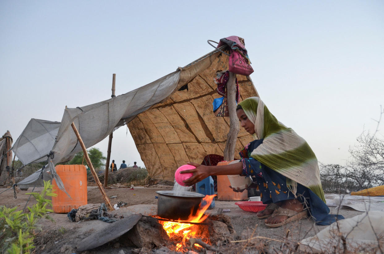 A girl prepares tea in the Jafferabad district