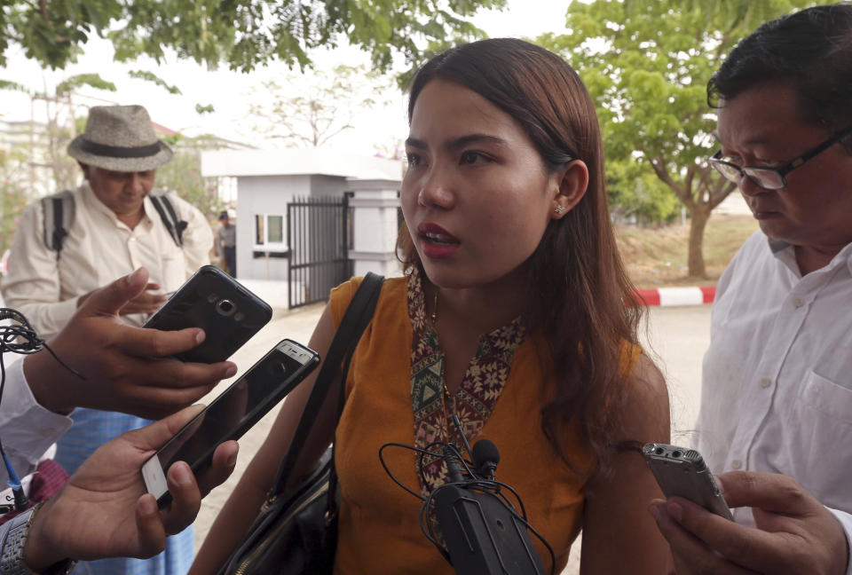 Chit Su Win, wife of Reuters journalist Kyaw Soe Oo, talks to journalists as she leaves the Supreme Court in Naypyitaw, Myanmar, Tuesday, April 23, 2019. Myanmar's Supreme Court on Tuesday rejected the final appeal of two Reuters journalists and upheld seven-year prison sentences for their reporting on the military's brutal crackdown on Rohingya Muslims. (AP Photo/Aung Shine Oo)