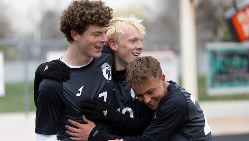 Murray Spartans Dillon Curtis (17), Murray Spartans Preston Lawson (10), and Murray Spartans Jacob Riches (22) celebrate a goal during a game against the Park City Miners at Murray High School in Murray on Friday, April 5, 2024.