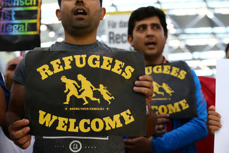 People protest against the German government's decision to deport migrants who were denied asylum, at Duesseldorf Airport, Germany September 12, 2017. REUTERS/Wolfgang Rattay