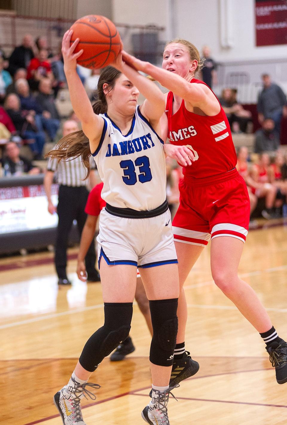 Dansbury's Natalie Rose is fouled by Mansfield Christian's Noelle Beare.