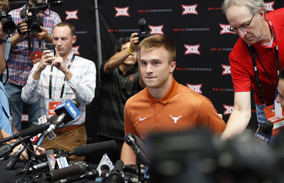 Texas quarterback Sam Ehlinger sits down for interviews during Big 12 Conference NCAA college football media day Tuesday, July 16, 2019, at AT&T Stadium in Arlington, Texas. (AP Photo/David Kent)