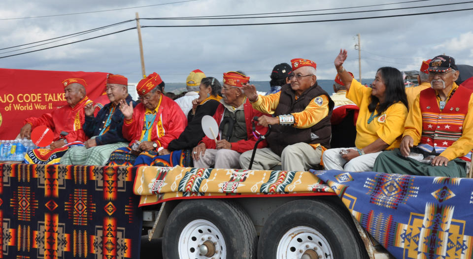 This undated image provided by the Navajo Tourism Department shows a group of Navajo Code Talkers during the 2011 Navajo Nation Fair parade in Window Rock, Ariz. An economic impact study and yearlong survey show spending by tourists on the Navajo Nation has increased by nearly one-third since 2002. (AP Photo/Navajo Tourism Department, Roberta John)