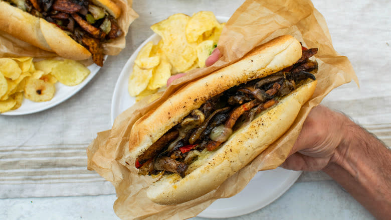 Vegetarian tempeh cheesesteak with chips