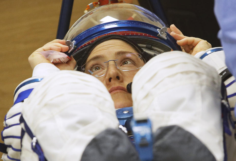 U.S. astronaut Christina Hammock Koch, member of the main crew of the expedition to the International Space Station (ISS), looks on during inspecting her space suit prior the launch of Soyuz MS-12 space ship at the Russian leased Baikonur cosmodrome, Kazakhstan, Thursday, March 14, 2019. (AP Photo/Dmitri Lovetsky)