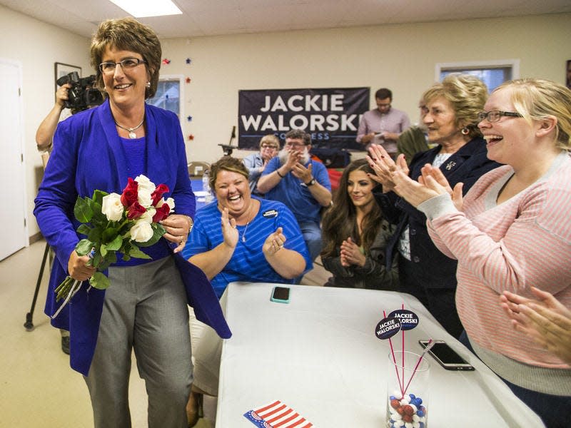 U.S. Rep. Jackie Walorski, R-Jimtown, is greeted with applause and roses as she enters the St. Joseph County Republican Party Headquarters on Tuesday, May 3, 2016, in South Bend. Tribune Photo/ROBERT FRANKLIN