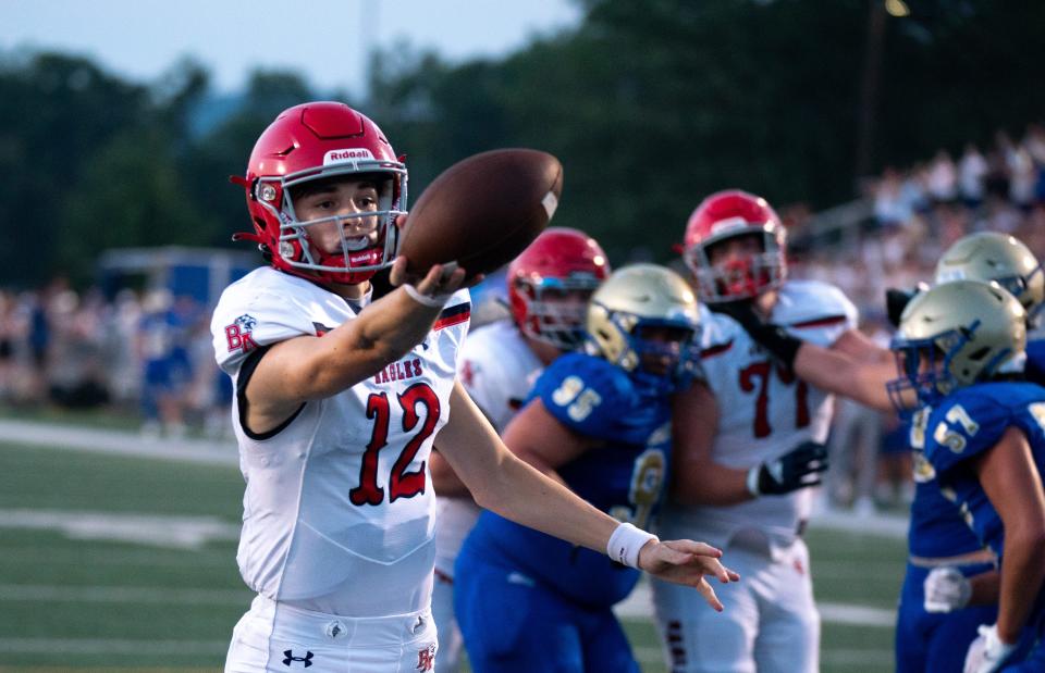 Brentwood Academy's George MacIntyre (12) crosses the goal line for a touchdown against Brentwood at James C. Parker Stadium Friday night, Aug. 25, 2023.