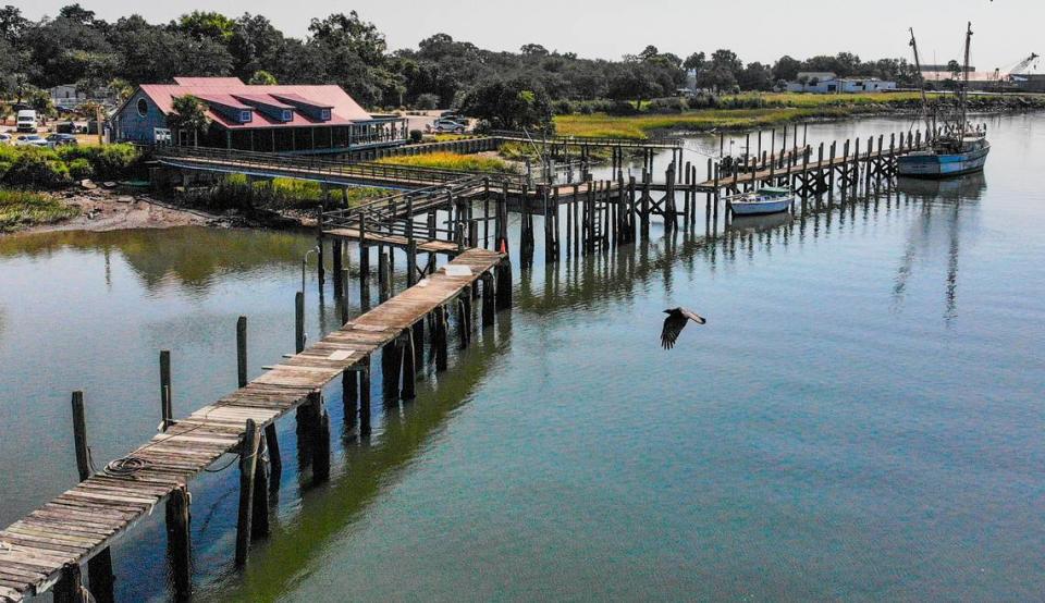 A shrimp and a sail boat are the sole remaining vessels as seen on Sept. 21, 2022 at the Town of Port Royal shrimp dock on Battery Creek. The town expects to demolish the dock this year and build a new one, in additional to a seafood processing facility.