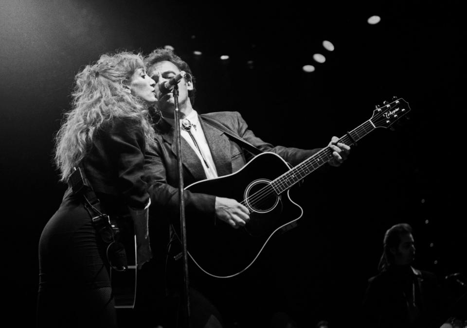 Patti Scialfa and Bruce Springsteen on stage March 14, 1988, at the Richfield Coliseum in Ohio.