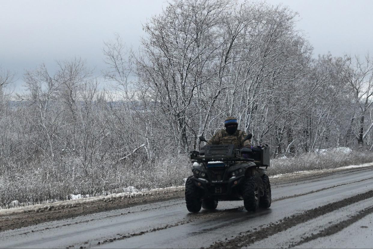 Ukrainian serviceman rides on a quad in Donetsk region after snowfall (AFP via Getty Images)