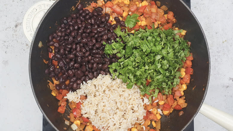 black beans, rice, and cilantro in pan