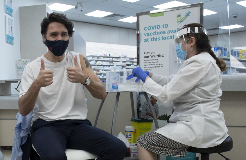 Prime Minister Justin Trudeau gives the thumbs up after receiving his COVID-19 AstraZeneca vaccination in Ottawa on Friday April 23, 2021. (Adrian Wyld/The Canadian Press via AP)