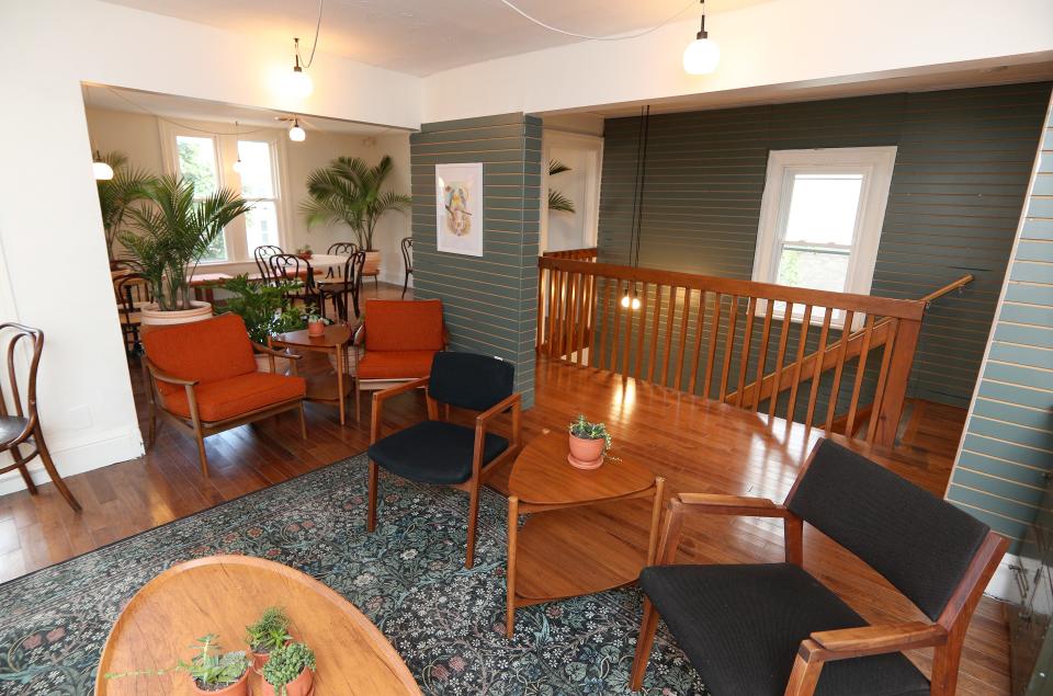 A beautifully decorated upstairs seating area at Hydra coffee on Monroe Avenue.