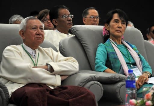 Myanmar democracy icon Aung San Suu Kyi (R), seen here attending the country's first forum on Green Economy and Green Growth in Yangon, on November 4. The authorities have given the green light to Suu Kyi's opposition to rejoin mainstream politics, setting the scene for the Nobel laureate to run for a seat in the new parliament