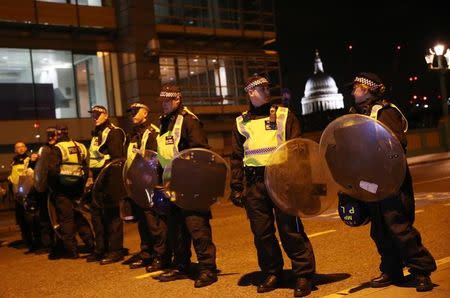 Police officers guard the approach to Southwark Bridge after an incident near London Bridge in London, Britain June 4, 2017. REUTERS/Neil Hall