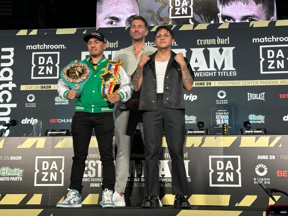 Juan Francisco Estrada (left) and Jesse Rodriguez face off with Matchroom Sport chairman Eddie Hearn on May 8, 2024, at the news conference announcing the fight at Footprint Center on June 29.