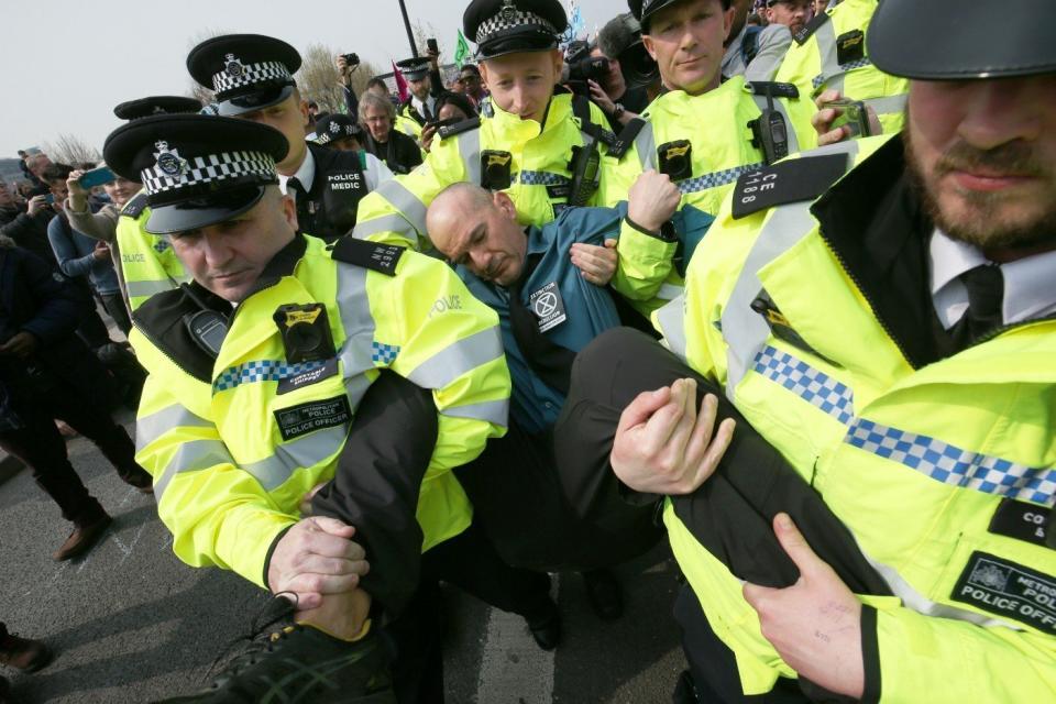 Police officers removed Extinction Rebellion demonstrators from Waterloo Bridges on Wednesday (PA)